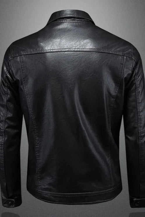 Black leather jacket on a gray background