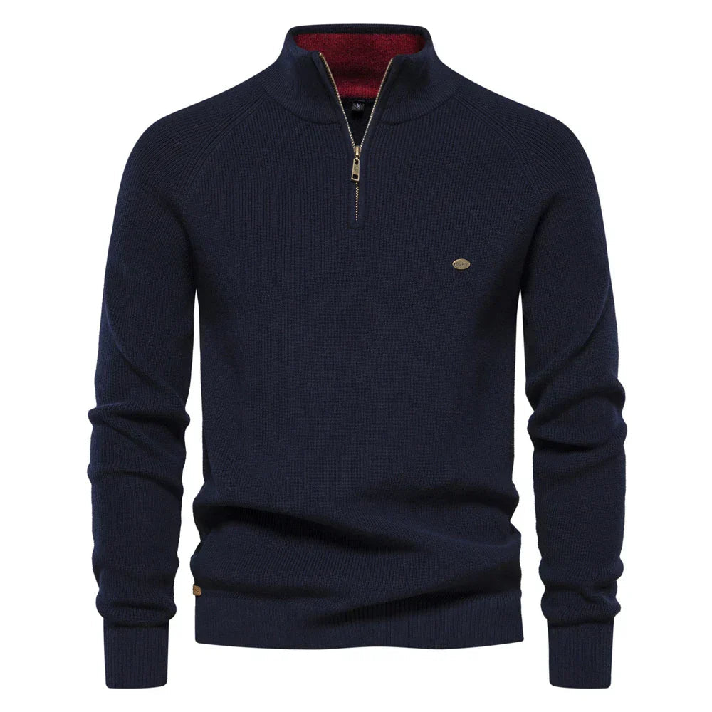 Navy blue sweater with a zipper on a white background