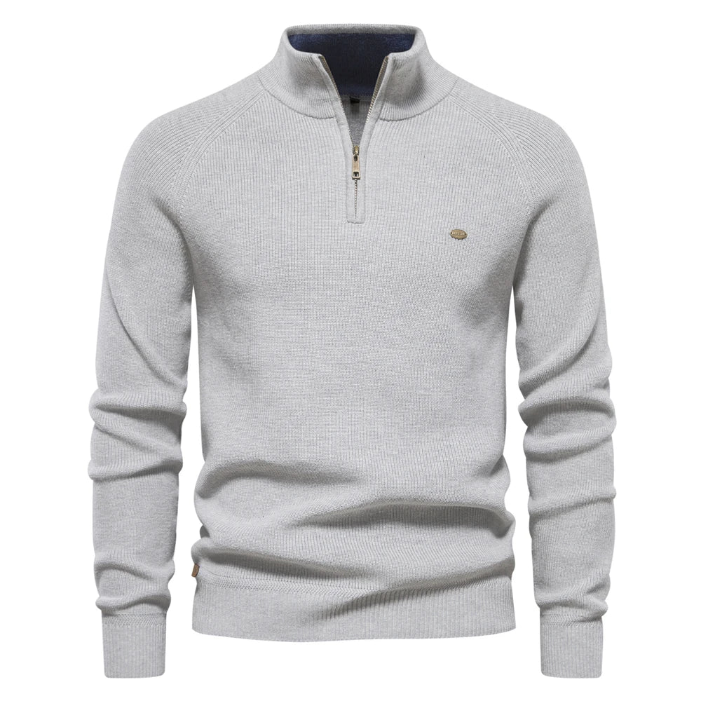 Gray sweater with a quarter zip on a white background