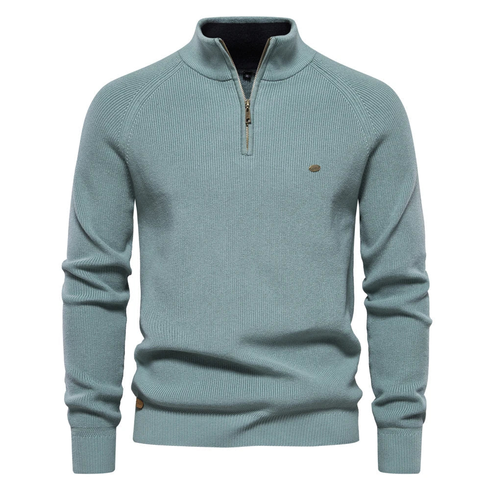 Light blue sweater with a quarter zip on a white background