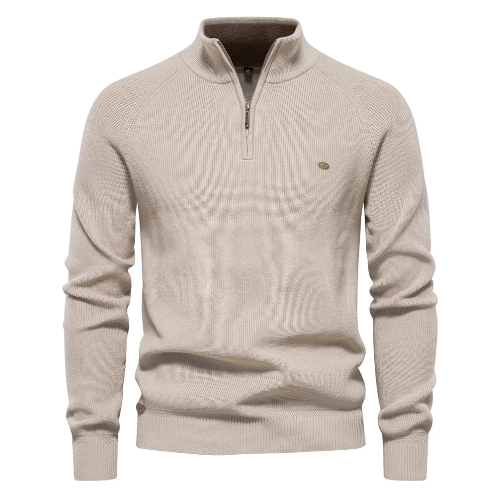 Beige sweater with a quarter zip on a white background