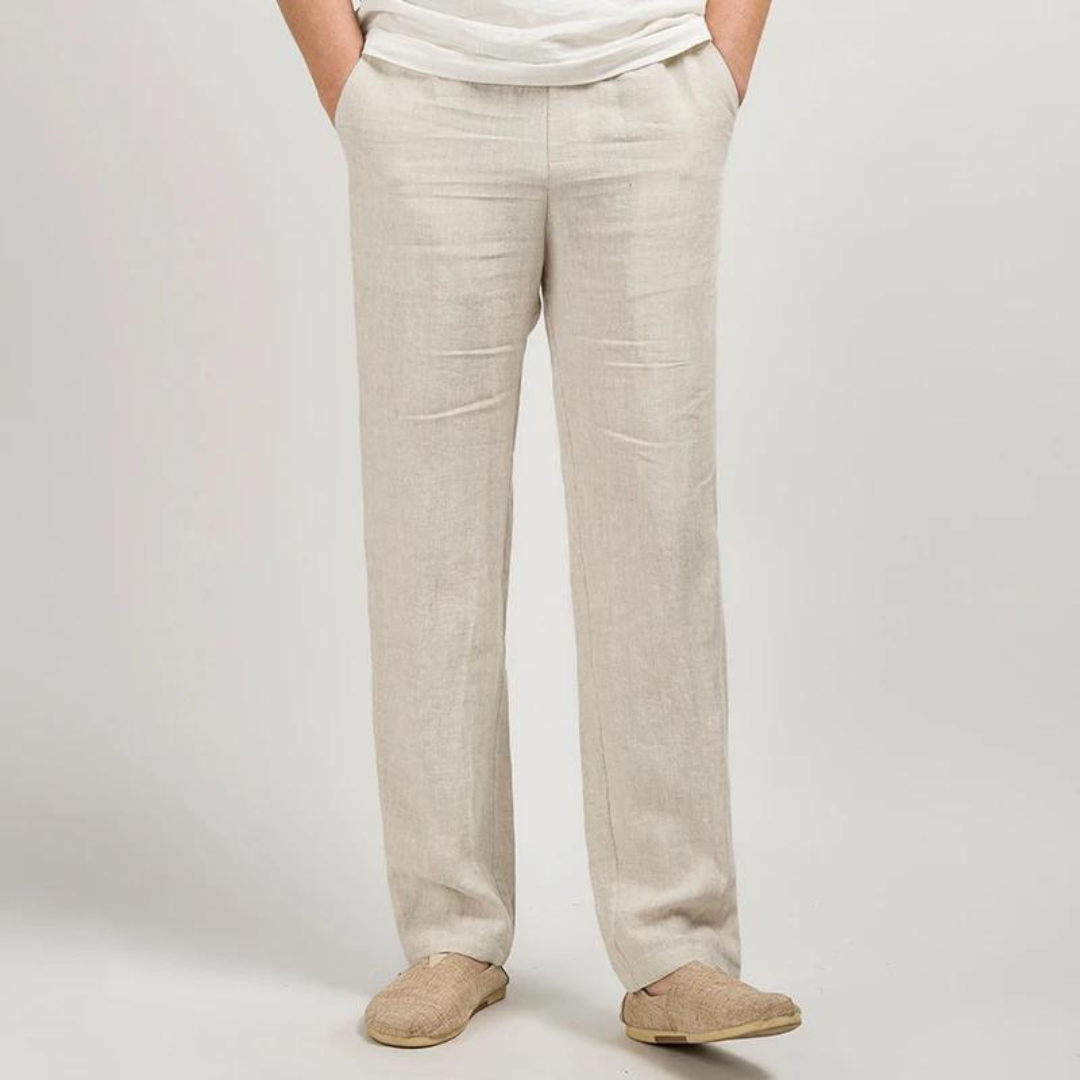Beige linen pants worn by a person on a plain background