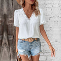Blusa da donna in pizzo con scollo a V e maniche corte