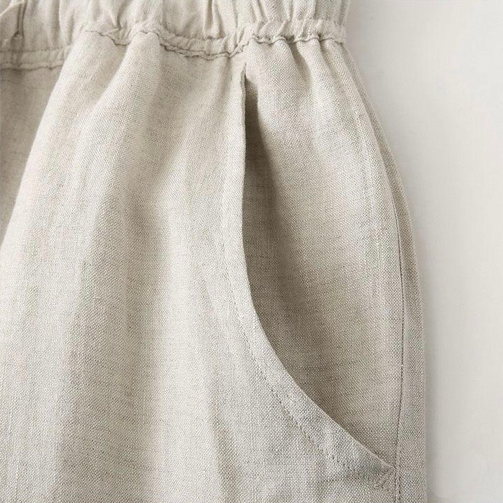 Close-up of a beige linen apron on a white background
