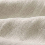 Close-up of textured beige linen fabric