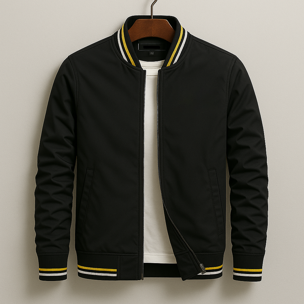 Black bomber jacket with yellow accents on a hanger against a beige background