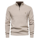 Beige sweater with a quarter zip on a white background