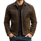 Brown leather jacket worn by a person on a white background