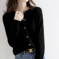Women's soft cashmere button-up cardigan, classic design, long sleeves, versatile for casual and formal outfits.