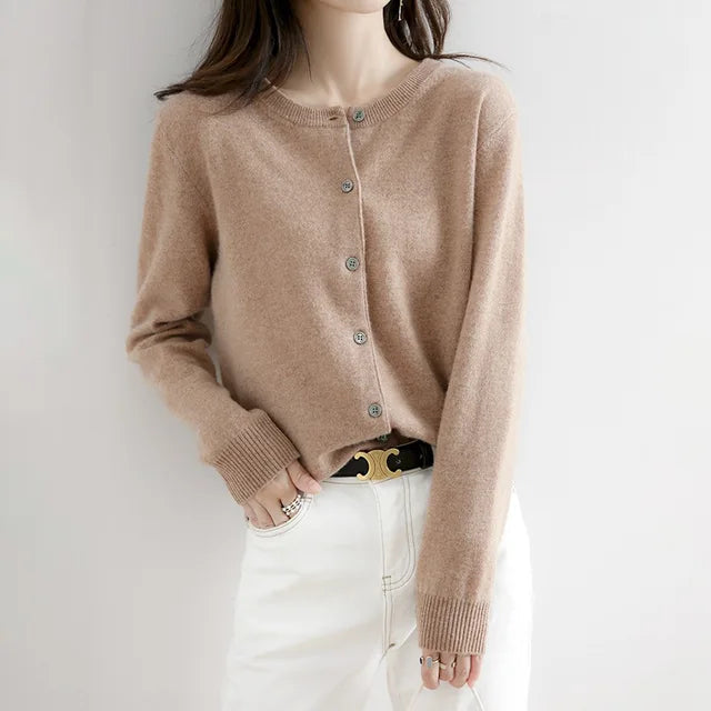 Women's soft cashmere button-up cardigan, classic design, long sleeves, versatile for casual and formal outfits.